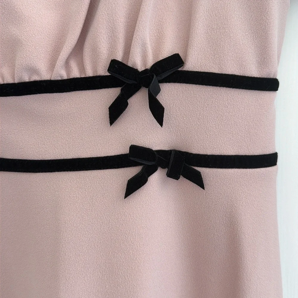 NWT girls Dillards in Girl blush pink dress. Black bows. Size 16